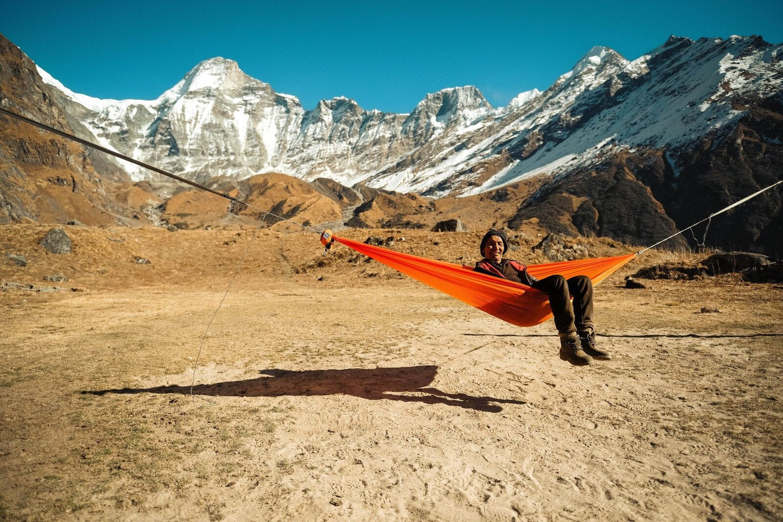 The orange Airlite Hammock hung at Api Base Camp, Nepal, 4,200 m