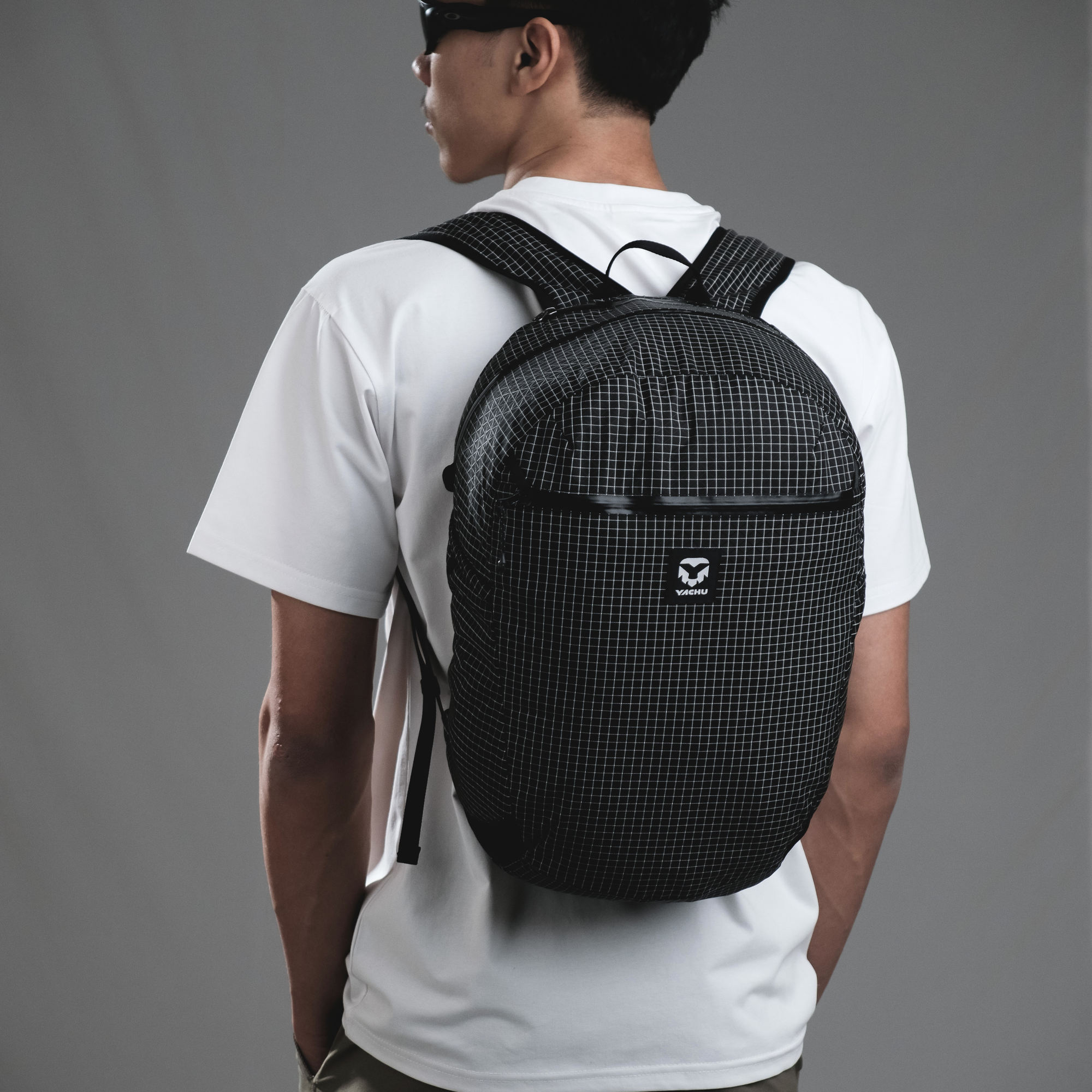 Sano Daypack worn while traveling, compact 18L daypack